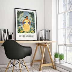 Matisse Art Prints - Woman Tropical Leaves Art Print displayed in a modern workspace with a black chair and plants.