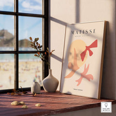 Matisse Art Prints - Abstract Birds Sun Shapes Poster displayed elegantly by a window with a beach view.