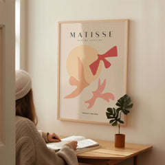 Matisse Art Prints - Abstract Birds Sun Shapes Poster displayed on wall, featuring minimalist design and warm tones.