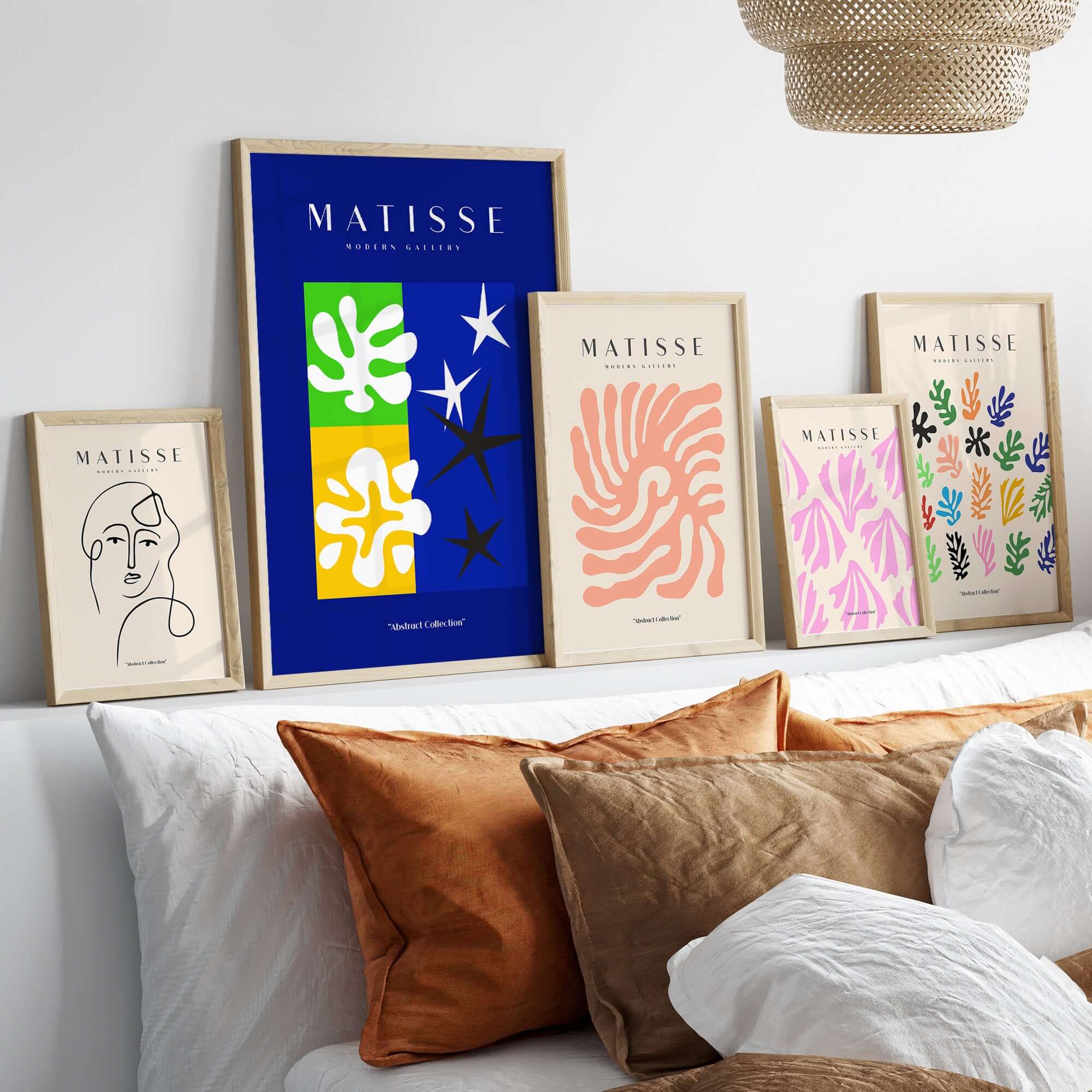 Matisse Art Prints - Abstract Blue Poster displayed among other colorful art prints and framed designs on a stylish wall.