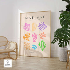 Matisse Art Prints - Abstract Botanical Shapes Grid Poster displayed in a stylish room with a palm plant.