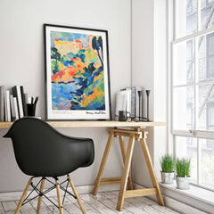 Matisse Art Prints - Abstract Coastal Landscape Poster displayed in a modern workspace with bright colors and a stylish chair.