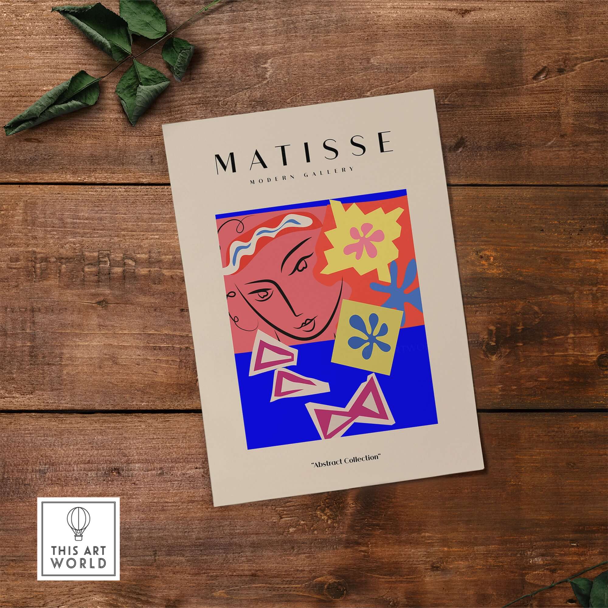 Matisse Art Prints - Abstract Face with Flowers Collage Wall Art displayed on a wooden surface with floral design elements.