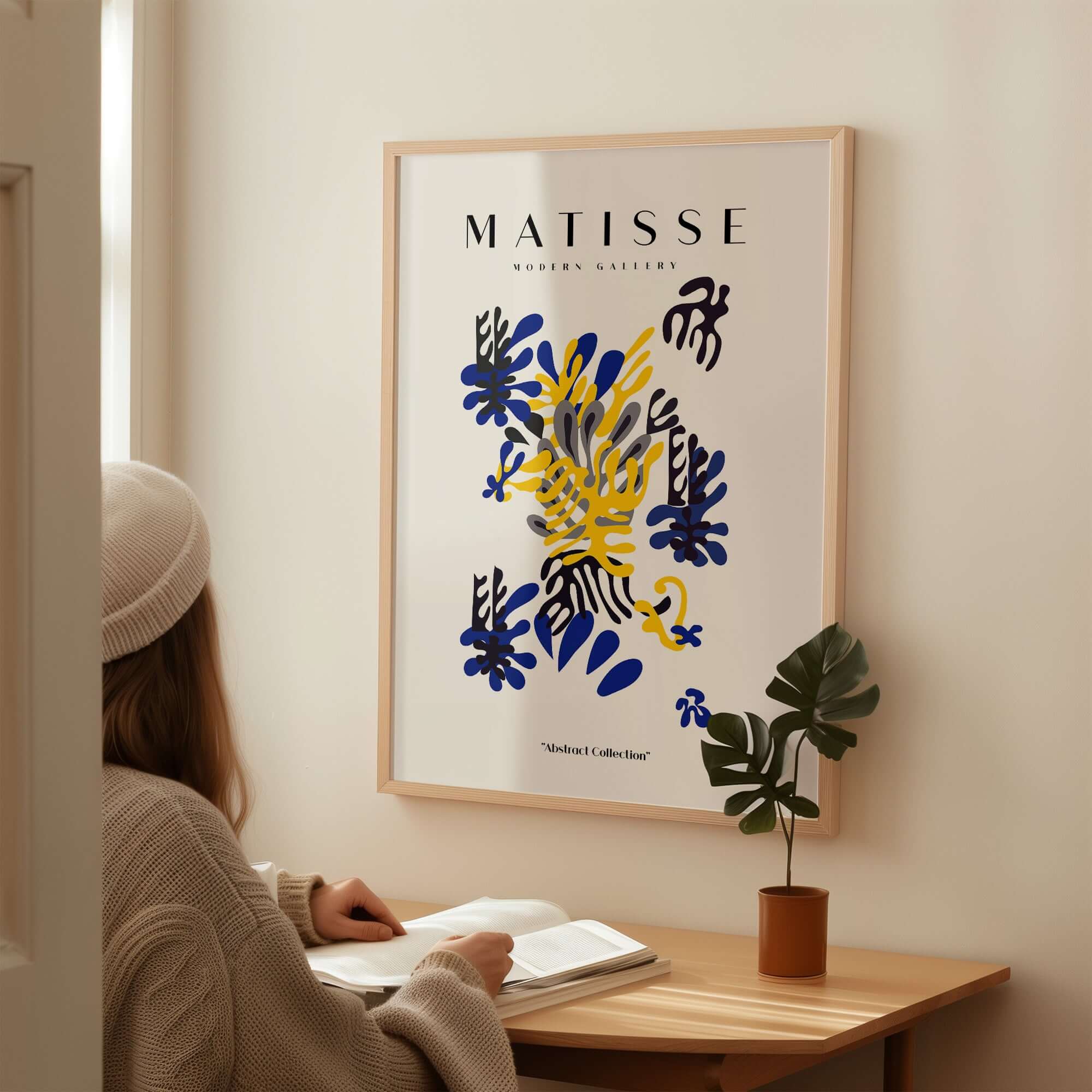 Matisse Art Prints -  Abstract Floral Blue Yellow Black Poster displayed on a wall, featuring dynamic floral shapes and colors.
