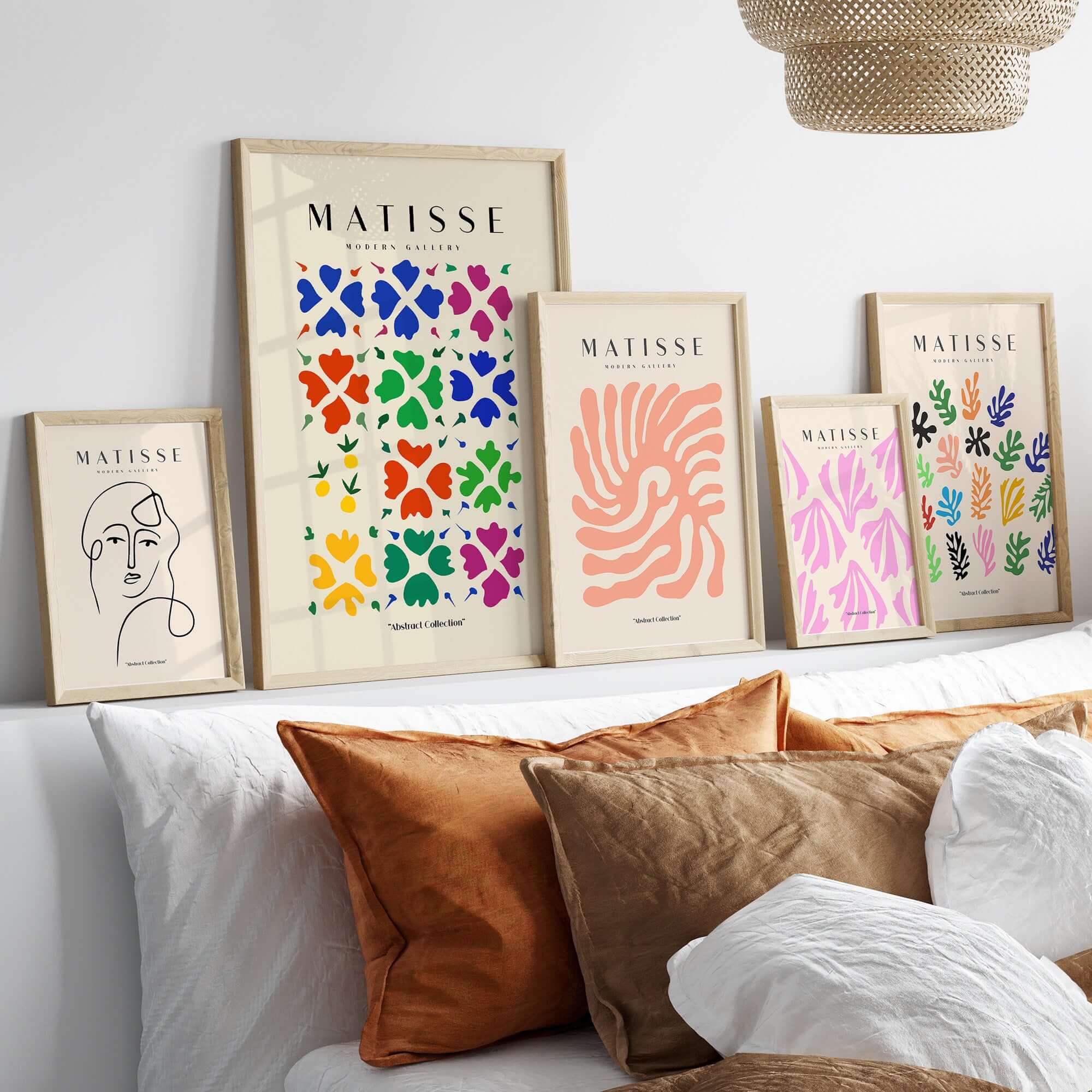 Matisse Art Prints - Abstract Floral Grid Poster displayed with other colorful art prints on a wall above a sofa.