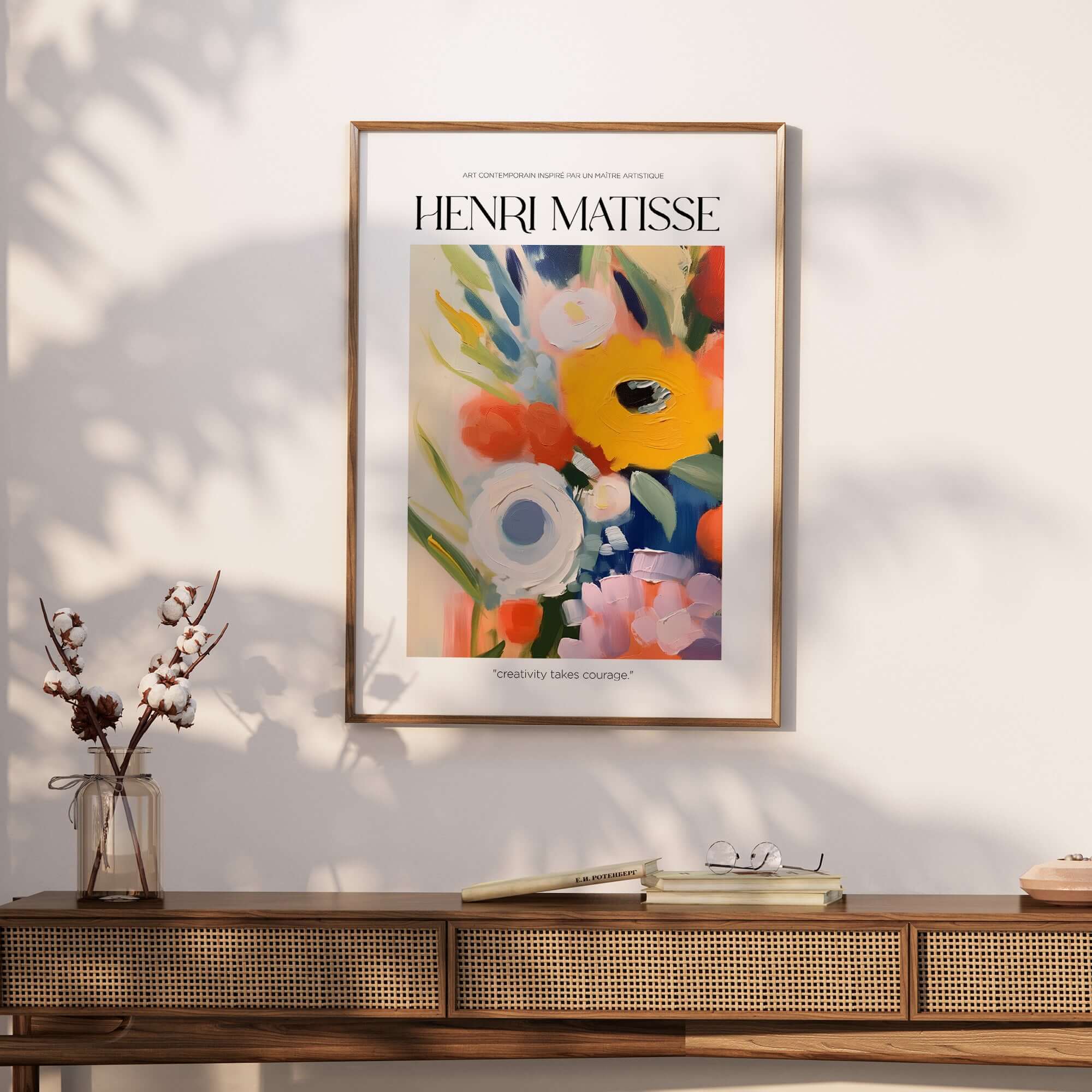 Matisse Art Prints - Abstract Flowers Poster showcasing vibrant floral art in a gold frame on a textured wall.