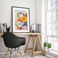 Matisse Art Prints - Abstract Flowers Poster displayed in a modern workspace with a black chair and plants.