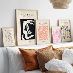 Matisse Art Prints - Abstract Organic Figure Cut Out Print displayed on a stylish wall with cushion accents.