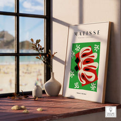 Matisse Art Prints -  Abstract Shape Red Green Poster displayed in a sunlit room with a beach view.