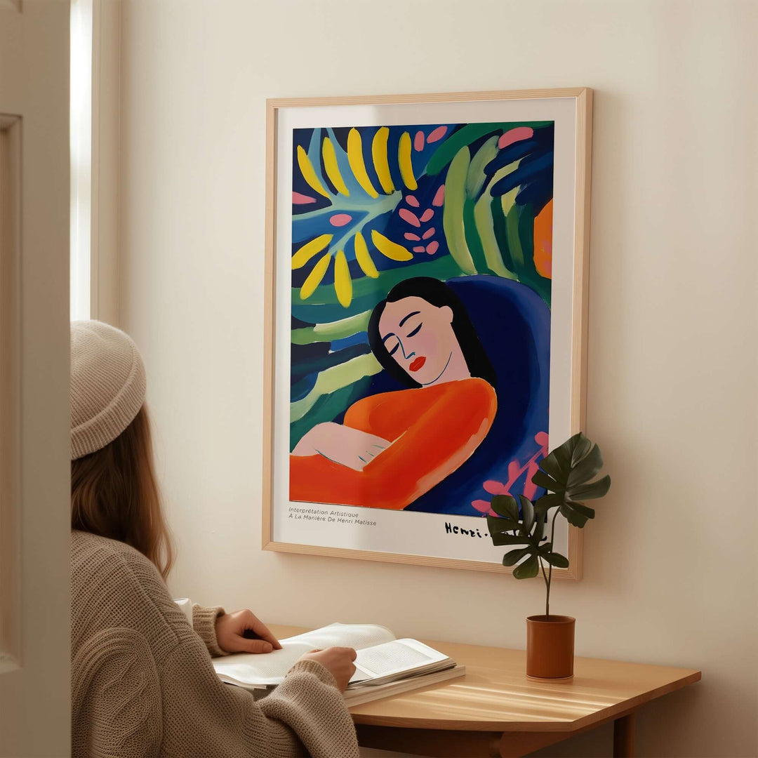 Matisse-inspired art print of a woman in orange, surrounded by vibrant foliage in a cozy home setting.