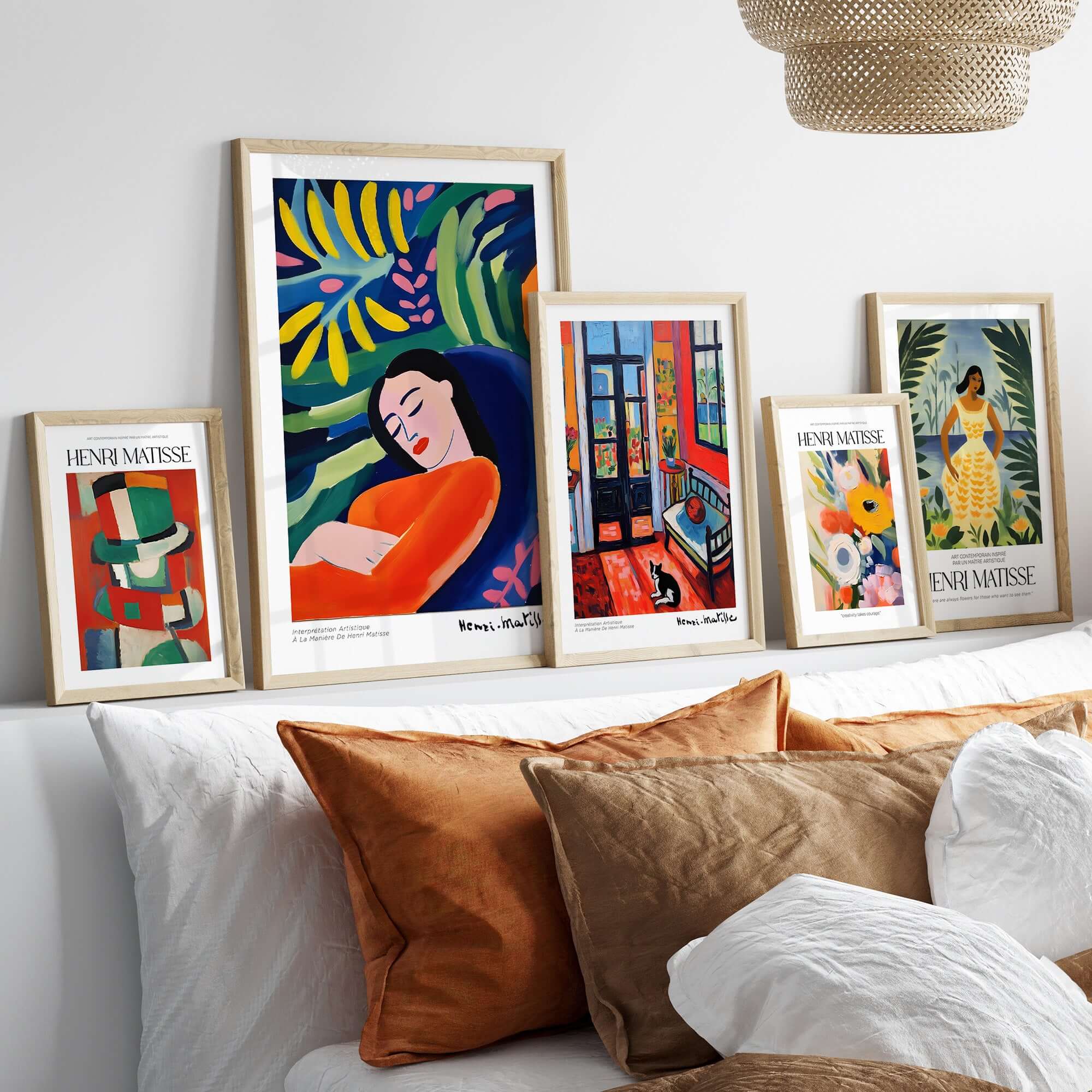 Matisse Art Prints - Abstract Woman in Foliage Poster displayed on a bright sofa with other colorful prints.
