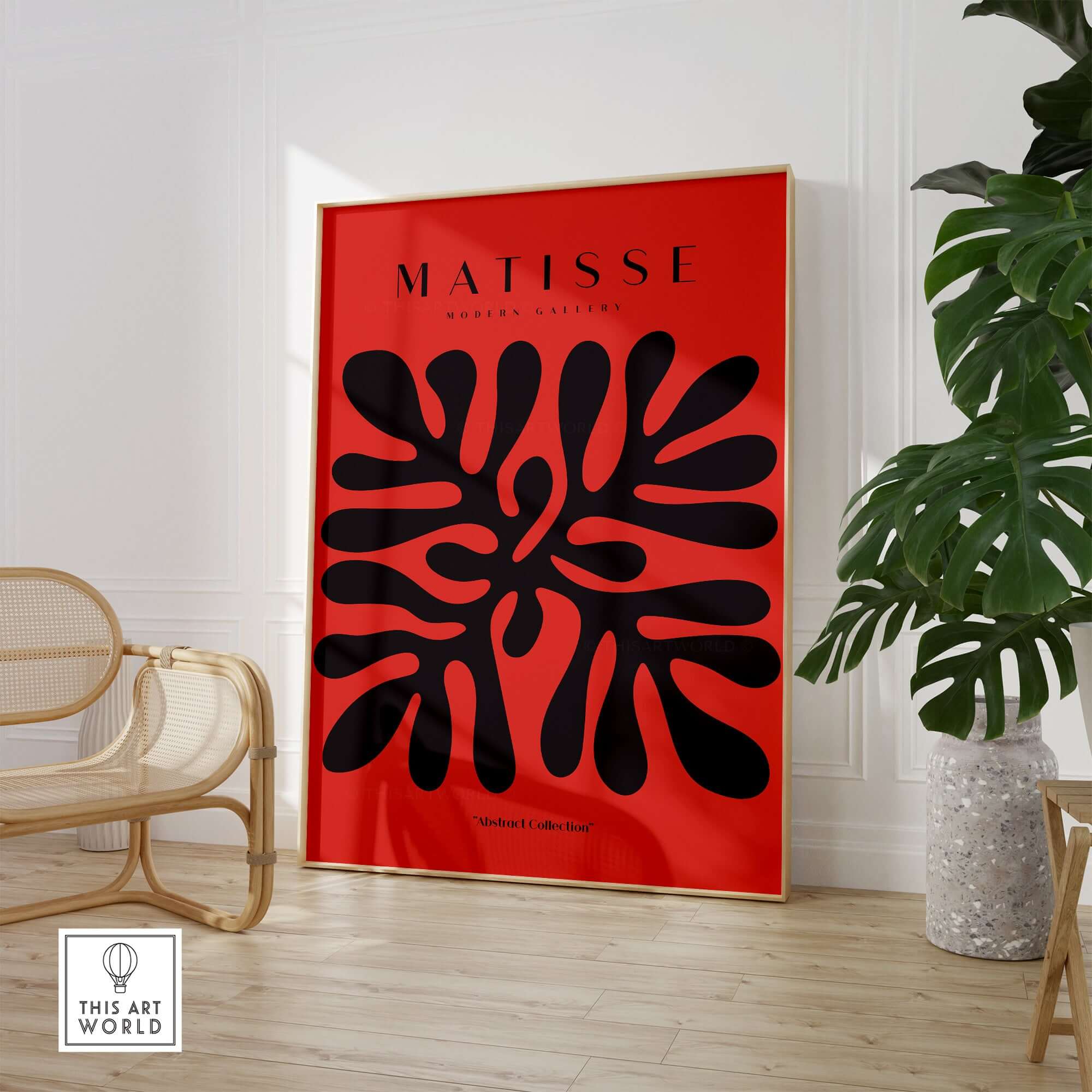 Matisse Art Prints -  Black Abstract Coral Shape Red Poster displayed in a modern interior featuring bold black shapes on red.