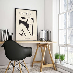 Matisse Art Prints - Black Abstract Nude Figure Poster displayed in a modern workspace setting.