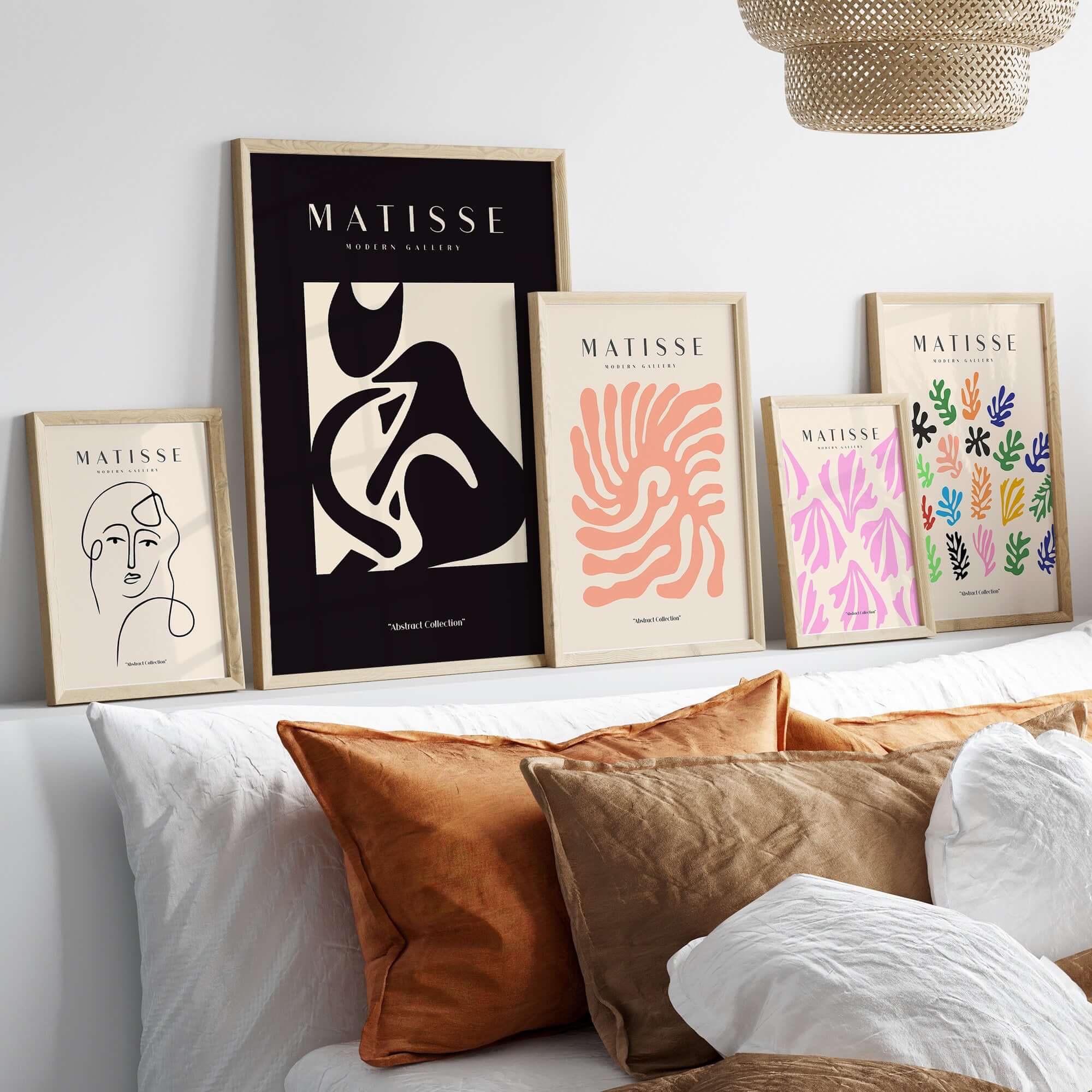 Matisse Art Prints - Black Beige Abstract Composition Poster displayed with other Matisse prints on a modern sofa.