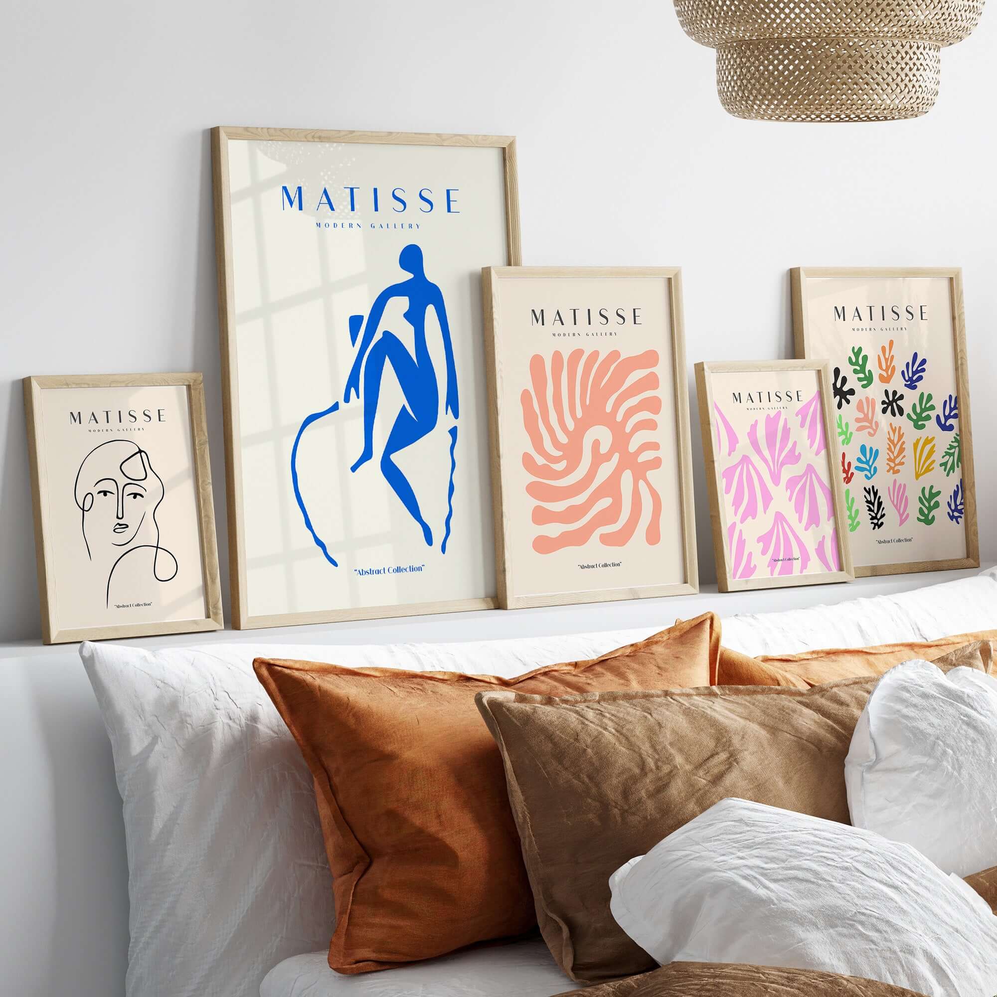 Matisse Art Prints -  Blue Nude Seated Figure Poster displayed on a shelf with other art prints in stylish frames.