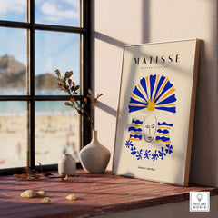 Matisse Art Prints -  Blue & Yellow Abstract Face displayed in a sunlit room by a window with beach view.