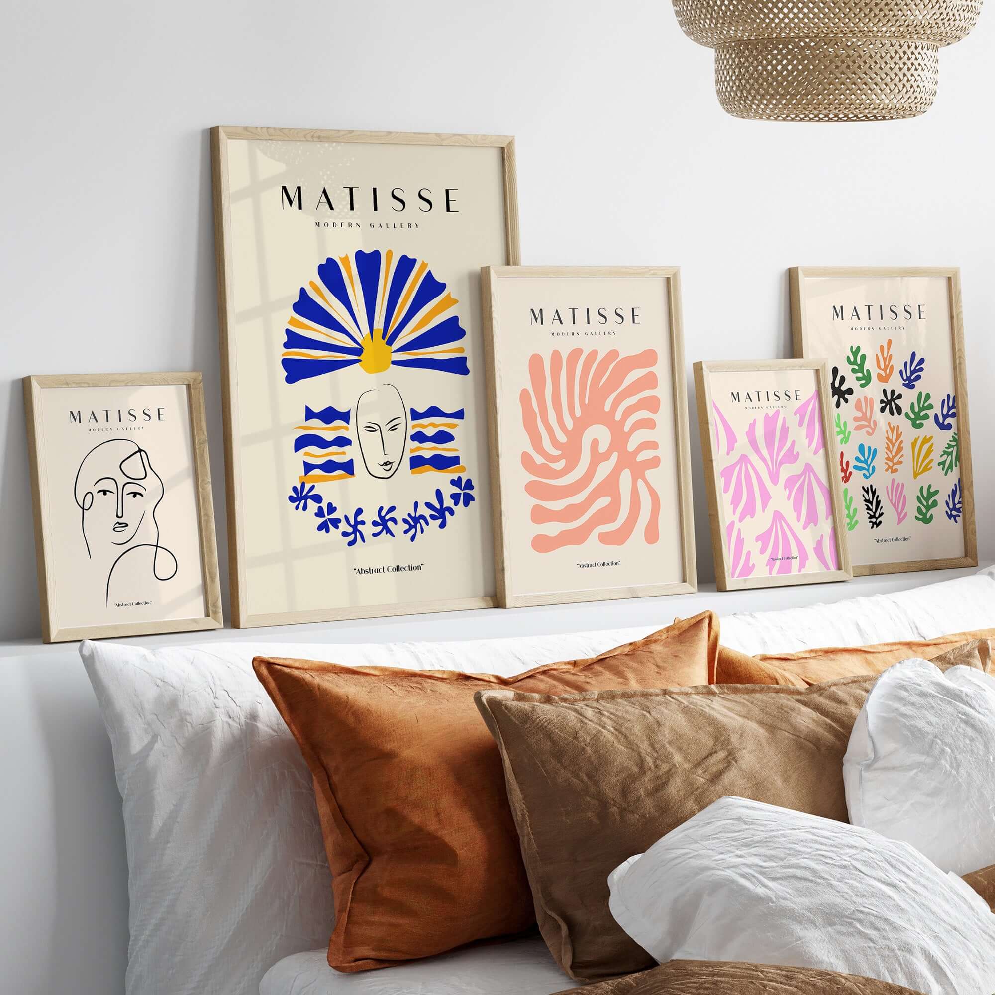 Matisse Art Prints - Blue & Yellow Abstract Face displayed among other Matisse prints on a stylish shelf.