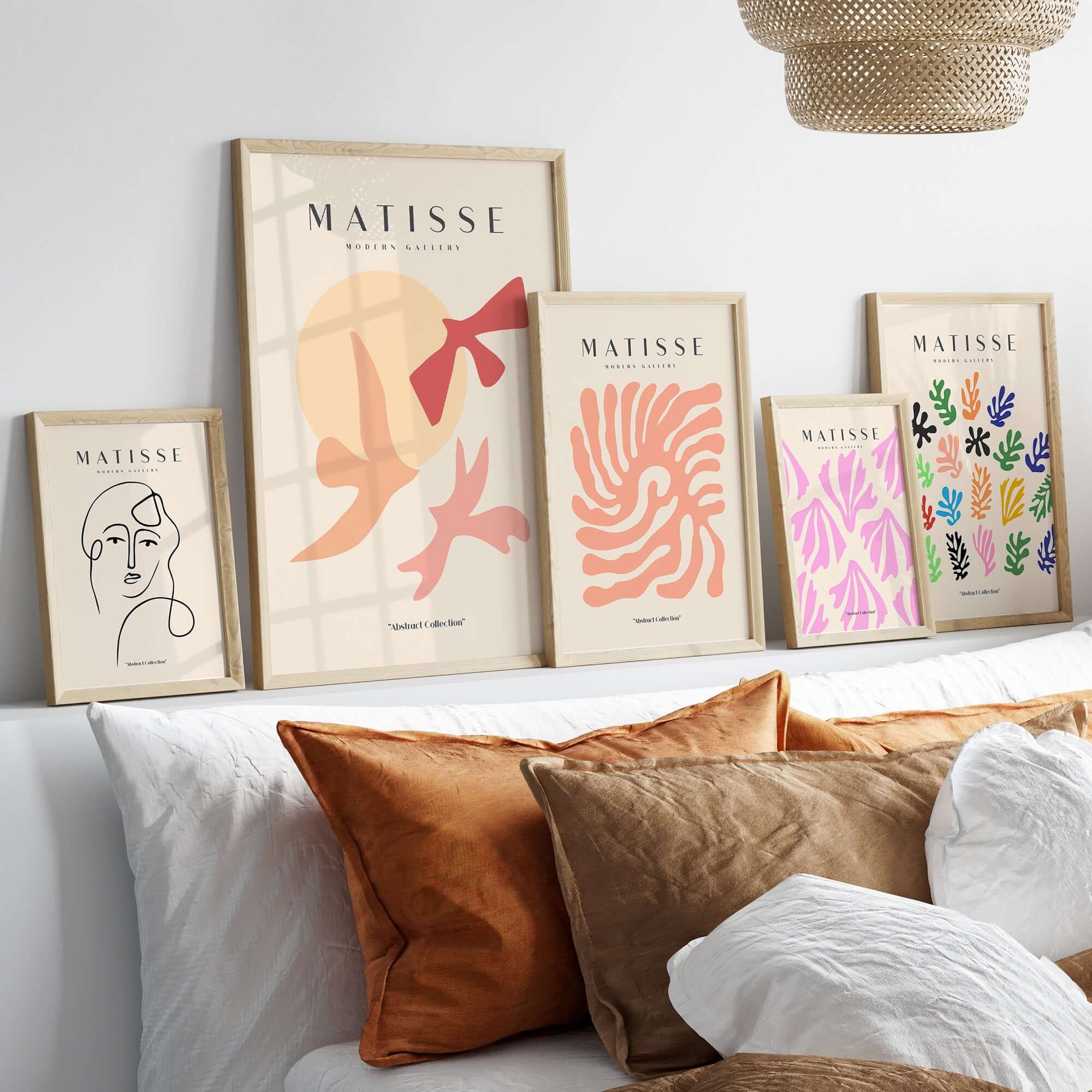 Matisse Art Prints - Abstract Birds Sun Shapes Poster displayed on a modern shelf with decorative pillows.