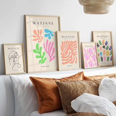 Matisse Art Prints - Colorful Abstract Cut Outs Wall Art displayed on a stylish wall, featuring vibrant cut-outs in various frames.