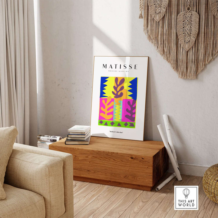 Colorful Matisse abstract leaves wall art displayed in a modern living room setting on a wooden table.