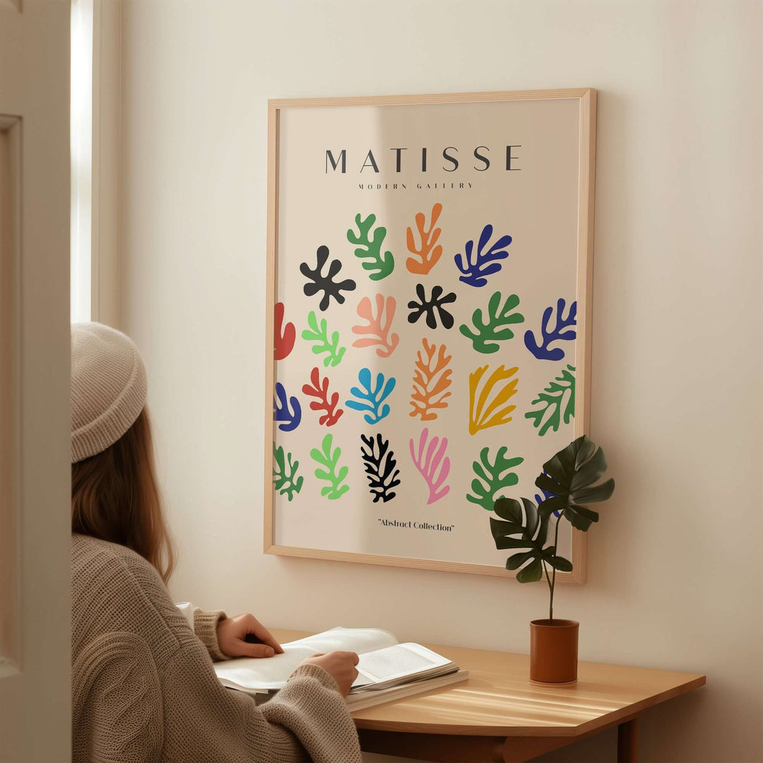 Matisse art print with colorful abstract shapes, displayed in a cozy interior setting.