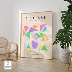 Matisse Art Prints - Colorful Geometric Triangles Poster in a modern interior setting with bright triangular shapes and beige background.