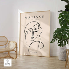 Matisse Art Prints - Continuous Line Abstract Face Poster displayed in a stylish interior with neutral tones.
