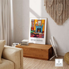Matisse Art Prints - Cozy Fireplace Interior Poster displayed in a living room with a cozy ambiance and vibrant colors.
