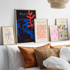 Matisse Art Prints -  Dance Blue Figures Poster and other vibrant art prints displayed on a stylish modern wall.