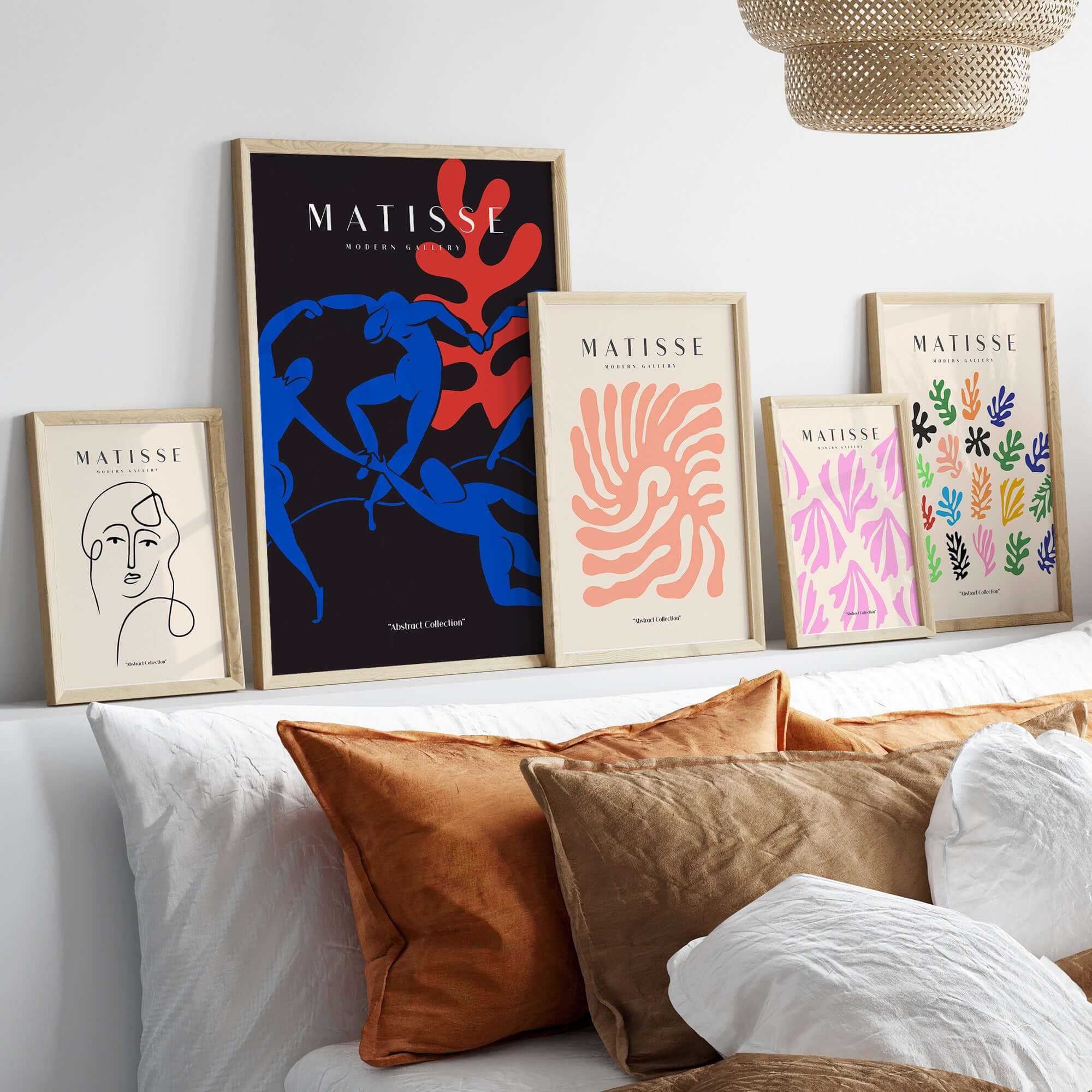 Matisse Art Prints -  Dance Blue Figures Poster and other vibrant art prints displayed on a stylish modern wall.