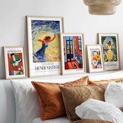 Matisse Art Prints - Dancing Figure Swirl Background Art Print displayed in stylish frames on a sofa.