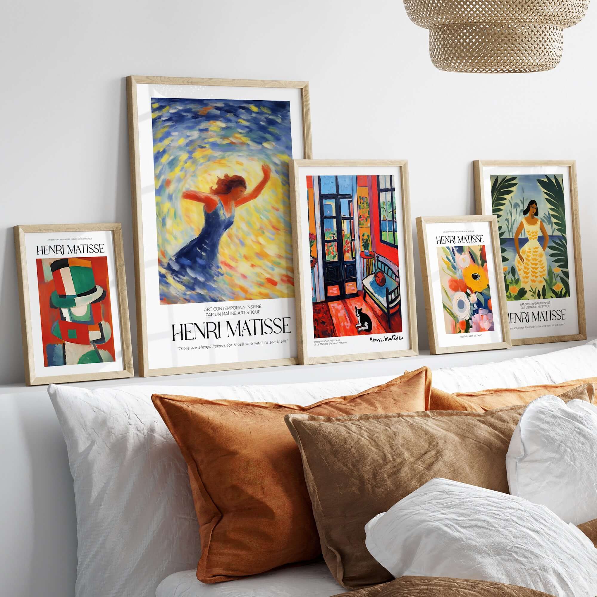 Matisse Art Prints - Dancing Figure Swirl Background Art Print displayed in stylish frames on a sofa.