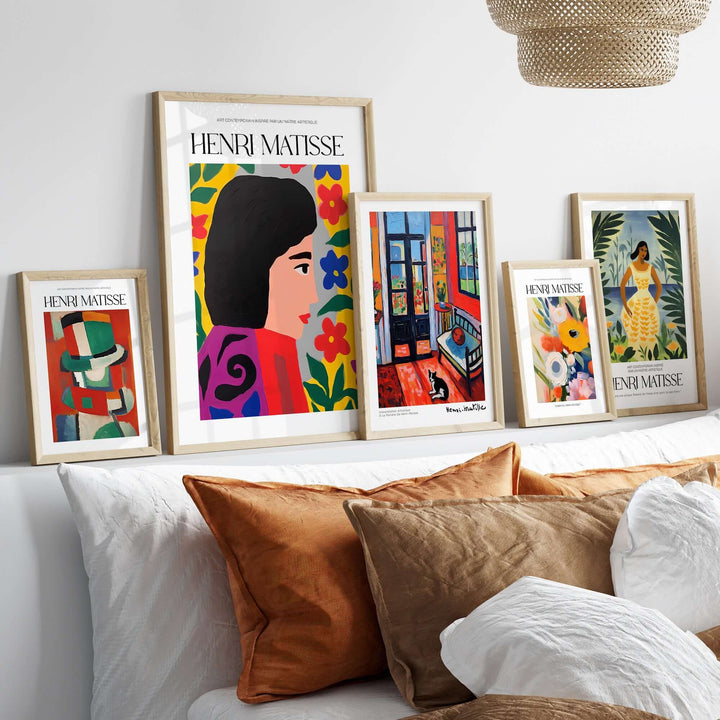 Vibrant Matisse art prints displayed above a cozy sofa, showcasing bold colors and floral designs, enhancing home decor.