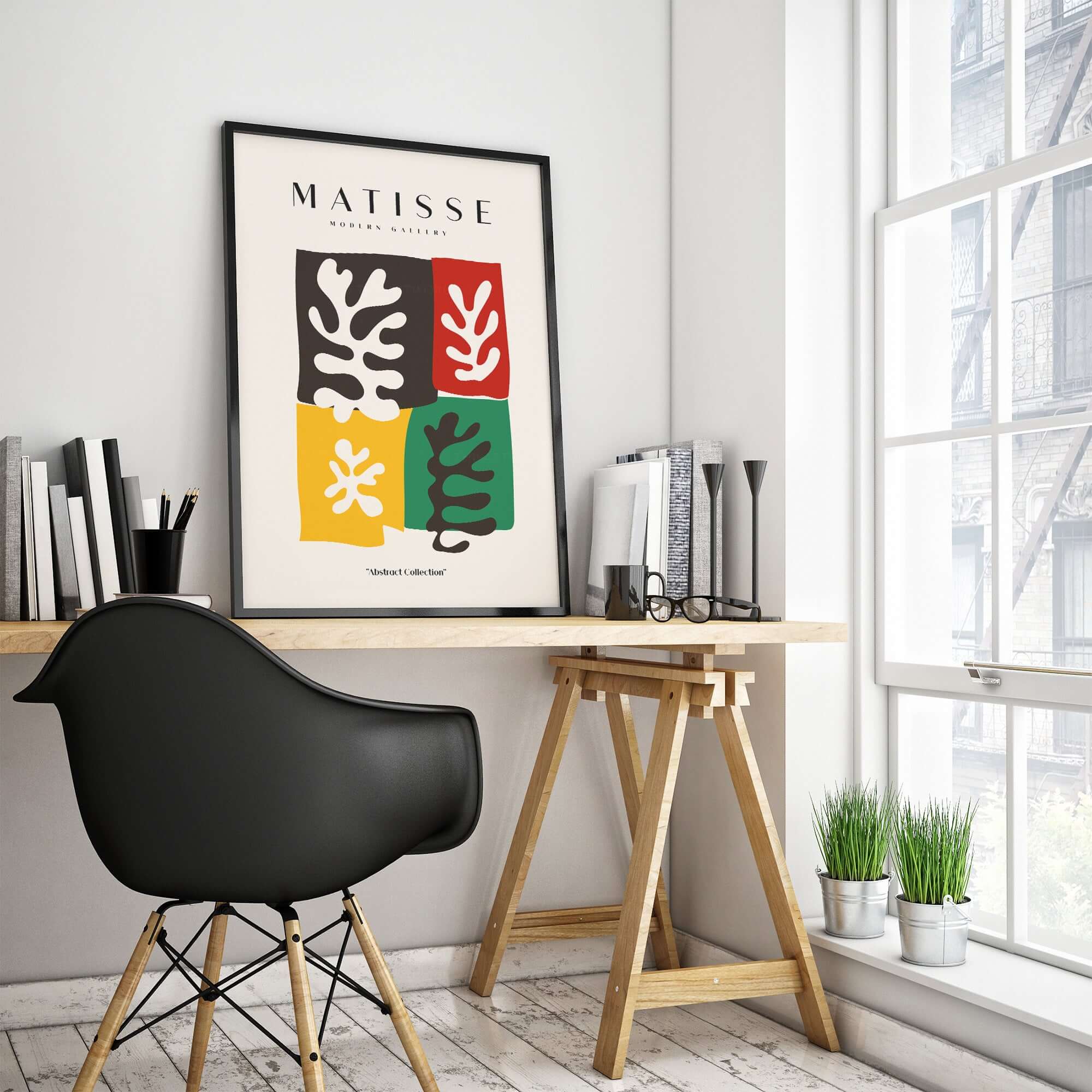 Matisse Art Prints - Four Blocks Abstract Leaves Color Poster displayed in a modern workspace with a black chair.