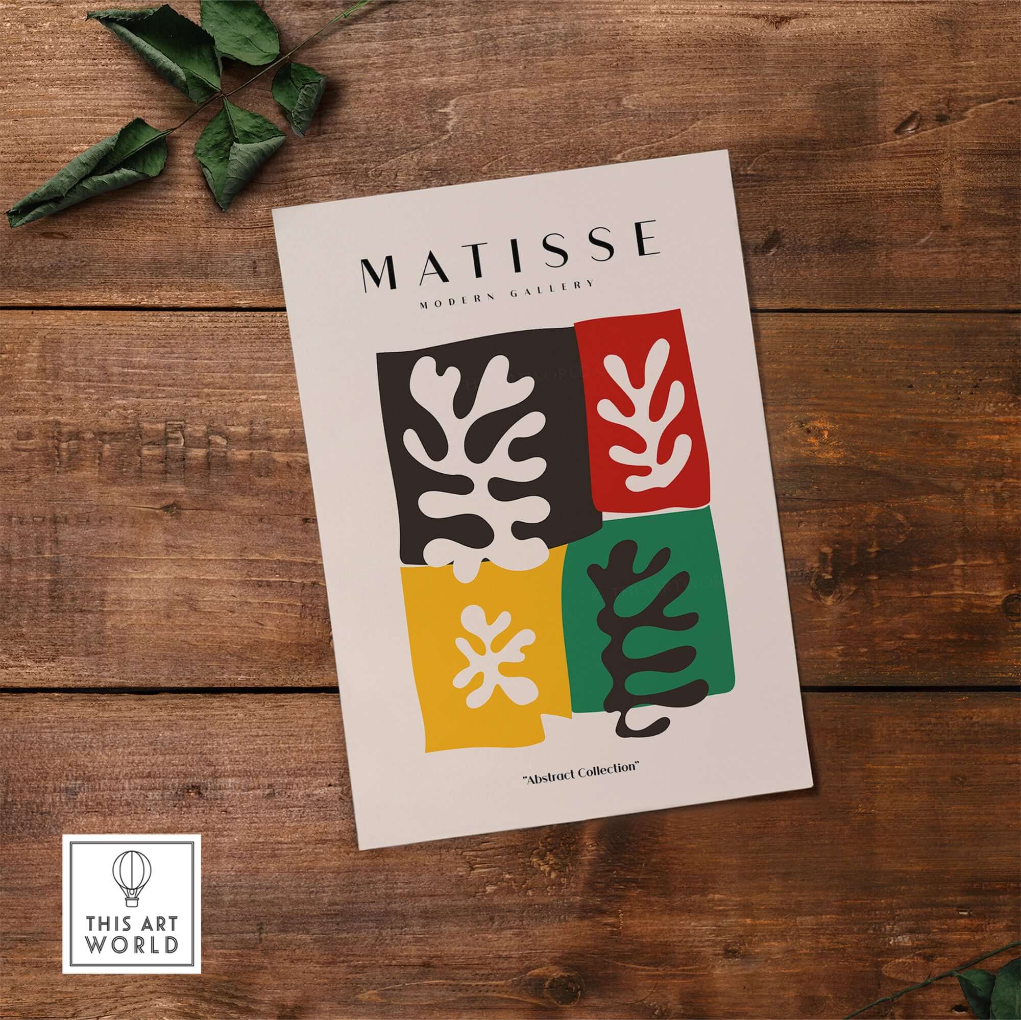 Matisse Art Prints - Four Blocks Abstract Leaves Color Poster displayed on a wooden surface with foliage.