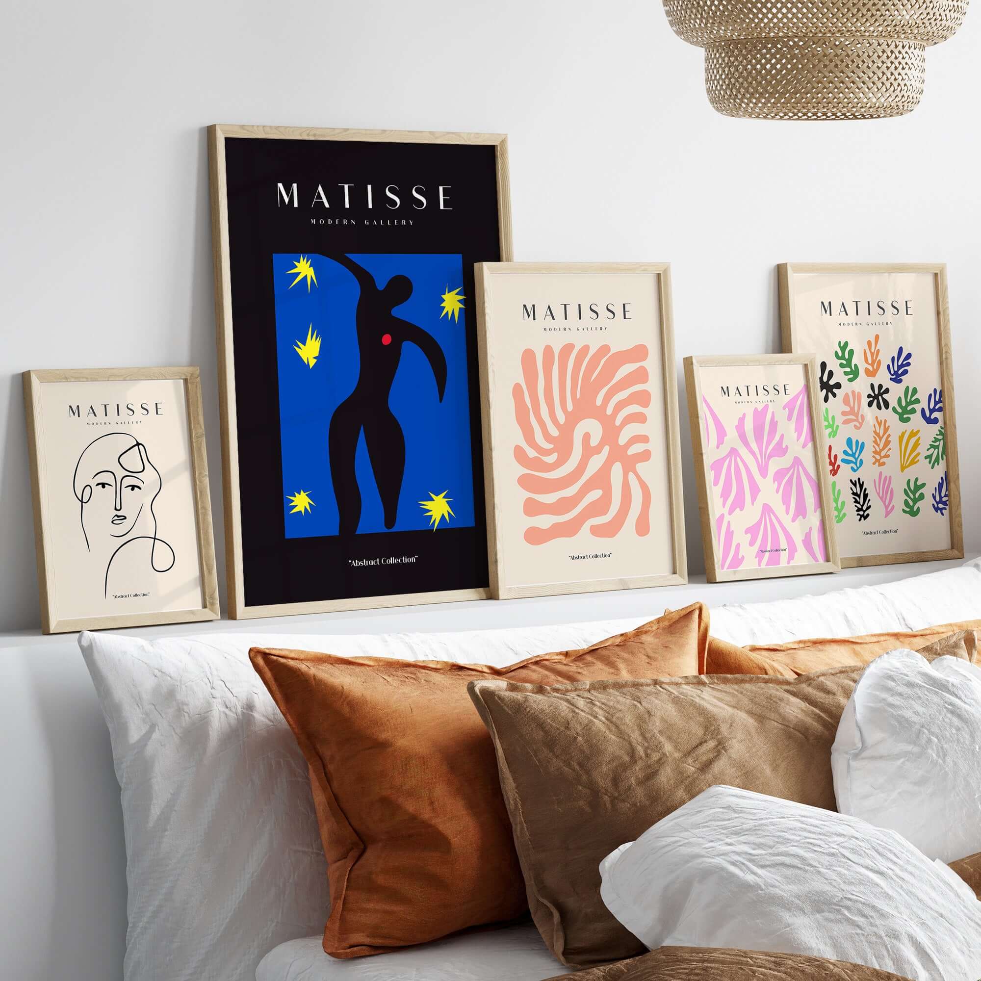 Matisse Art Prints - Icarus Black Figure with Stars Poster displayed on a wall with other Matisse art frames.