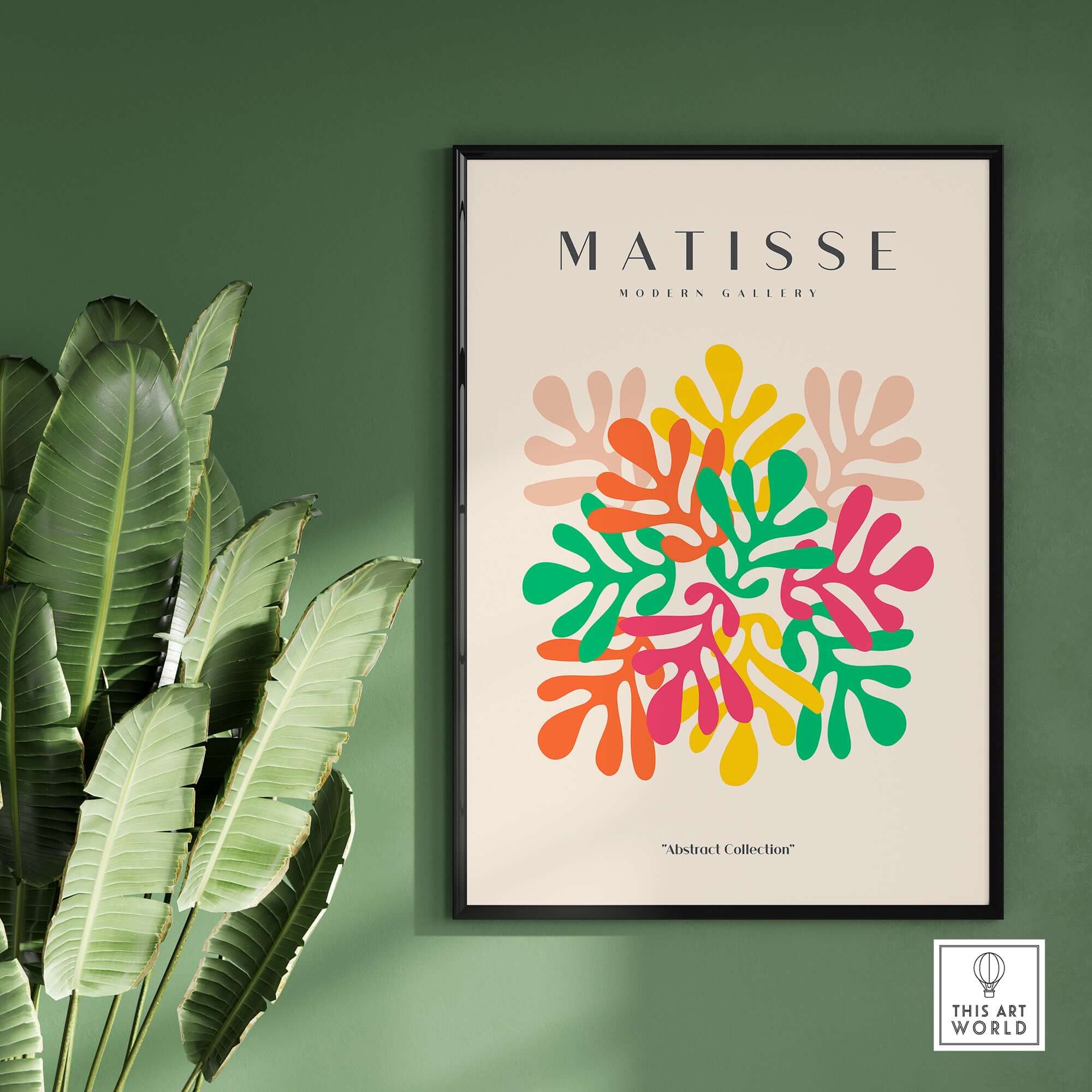 Matisse Art Prints - Interlocking Colorful Leaves Abstract Print displayed on wall with vibrant leaf designs and plant.