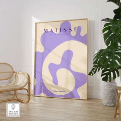 Matisse Art Prints -   Lavender Abstract Fluid Organic Shape Poster displayed in a stylish interior with plants and furniture.