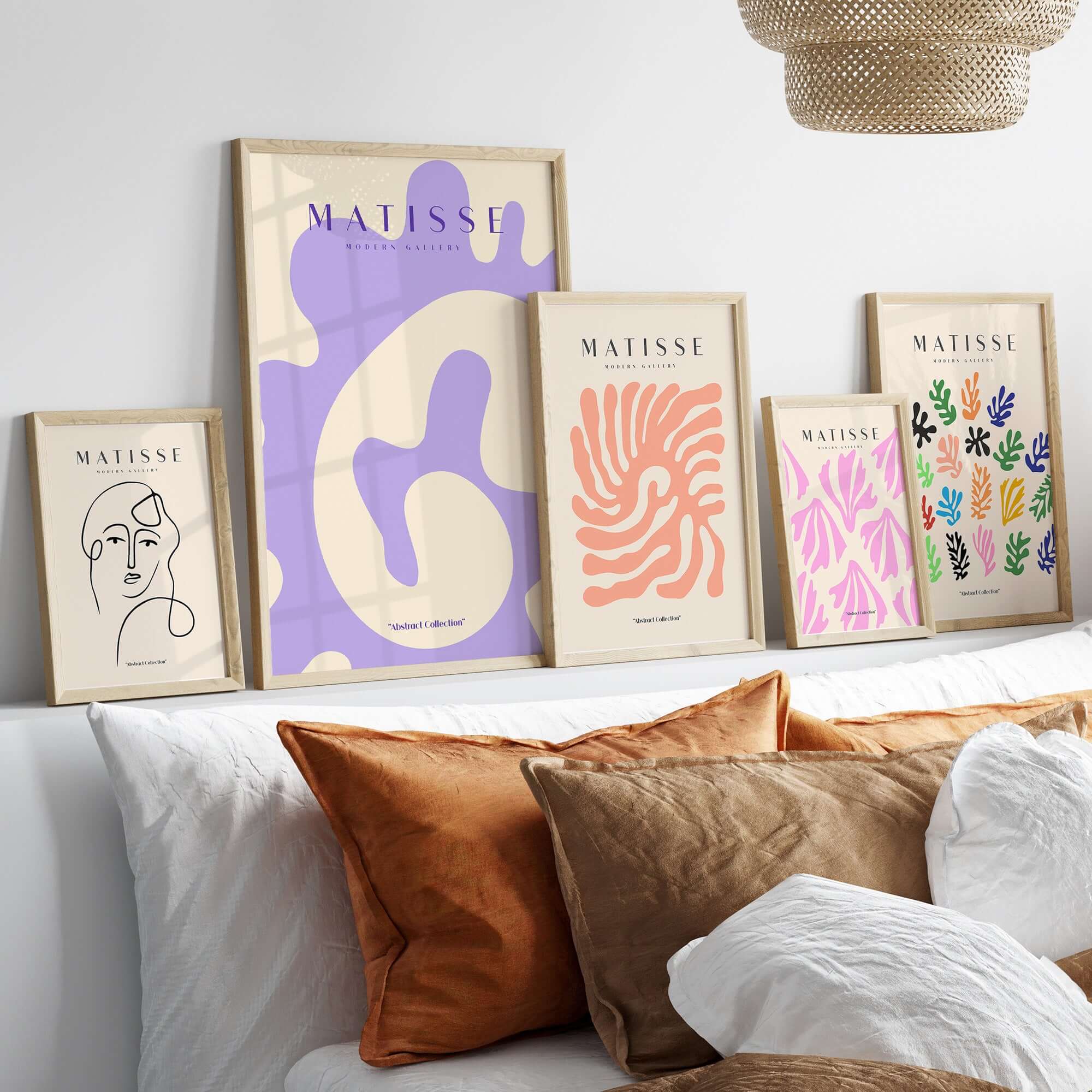 Matisse Art Prints - Lavender Abstract Fluid Organic Shape Poster displayed above a cozy sofa, showcasing contemporary art aesthetics.