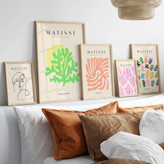 Matisse Art Prints - Lime Green Coral Abstract Sun Print displayed in a modern interior with decorative cushions.