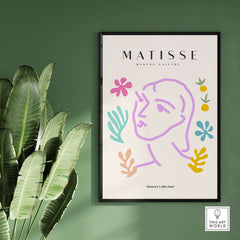 Matisse Art Prints -Line Art Face Abstract Botanical Collage Poster showcased in a frame with colorful abstract shapes.