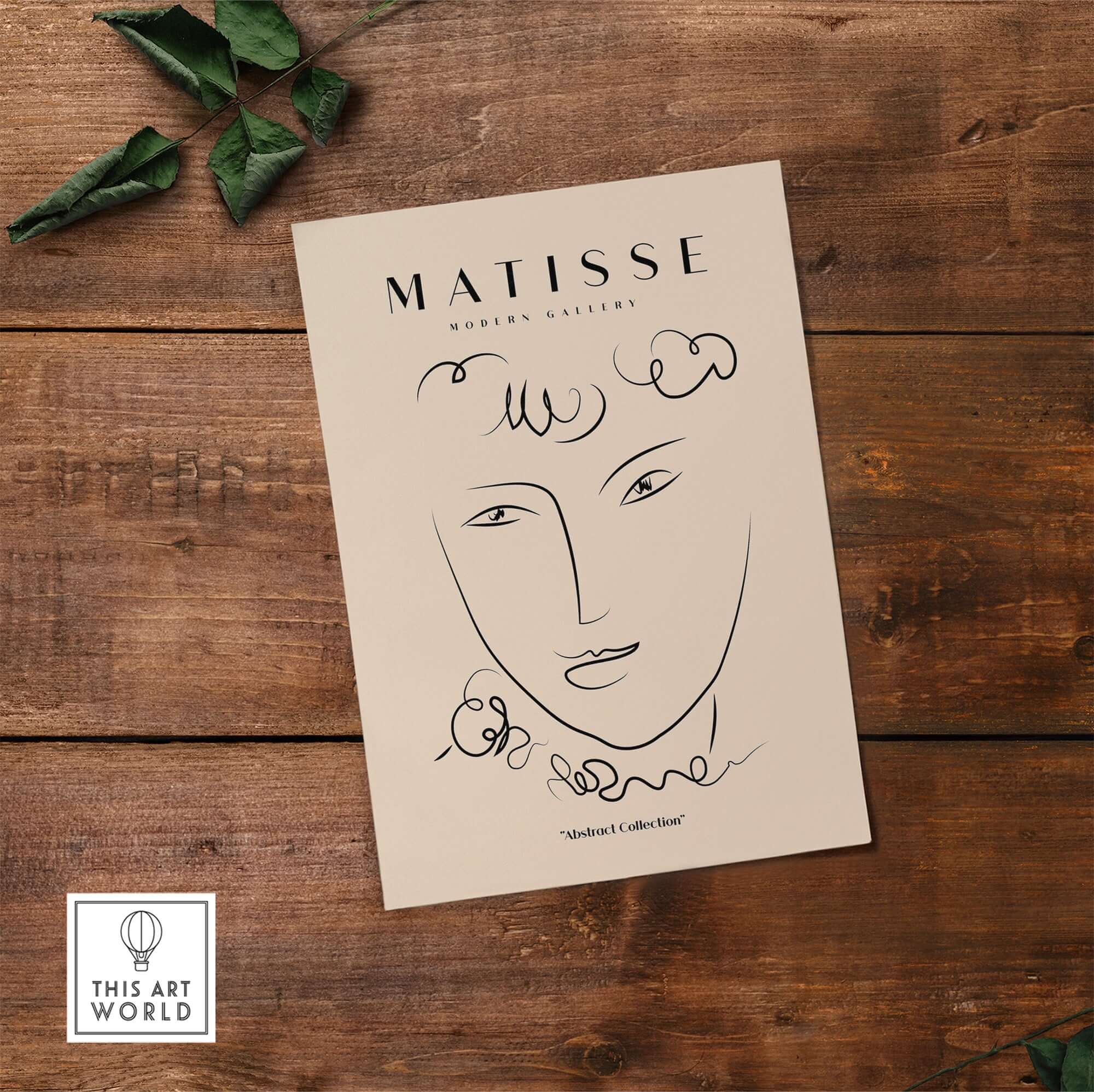 Matisse Art Prints -  Line Art Face Curly Hair Minimalist Poster displayed on a wooden surface with greenery.