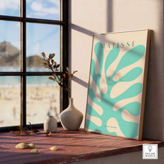 Matisse Art Prints - Mint Green Coral Abstract Seaweed Poster displayed on a windowsill, framed and styled.