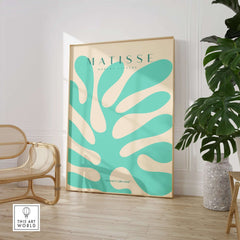 Matisse Art Prints - Mint Green Coral Abstract Seaweed Poster displayed in a modern interior setting with a plant.