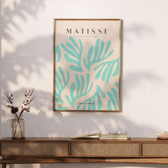 Matisse Art Prints - Mint Green Fan Pattern Poster Art displayed in a stylish interior with a wooden table and vase.