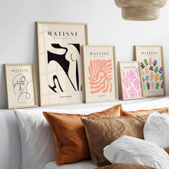 Matisse Art Prints - Black Abstract Nude Figure Poster showcased with other abstract art prints on a stylish wall decor.