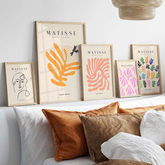 Matisse Art Prints - Orange Leaf Bird Silhouette Poster displayed on a stylish wall in modern decor featuring various art styles.