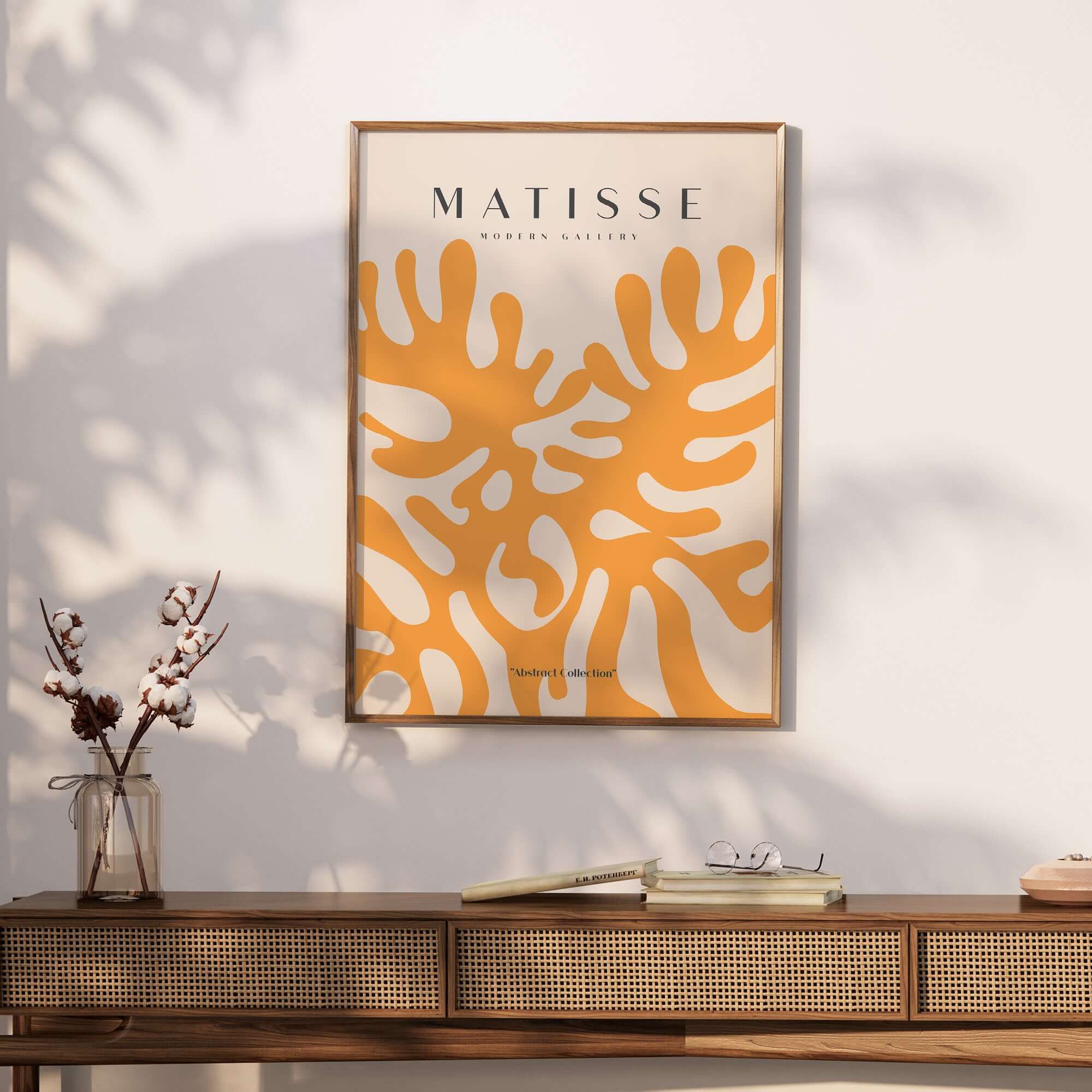 Matisse Art Prints - Orange Abstract Coral Pattern Poster displayed on a wall above a wooden table, showcasing a vibrant design.