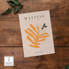 Matisse Art Prints - Orange Leaf Bird Silhouette Poster featuring abstract design with orange leaf and black bird.