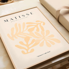 Matisse Art Prints - Pale Peach Abstract Shapes Wall Art displayed in a modern frame with floral shapes.